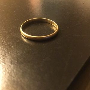 Women’s Gold band ring.